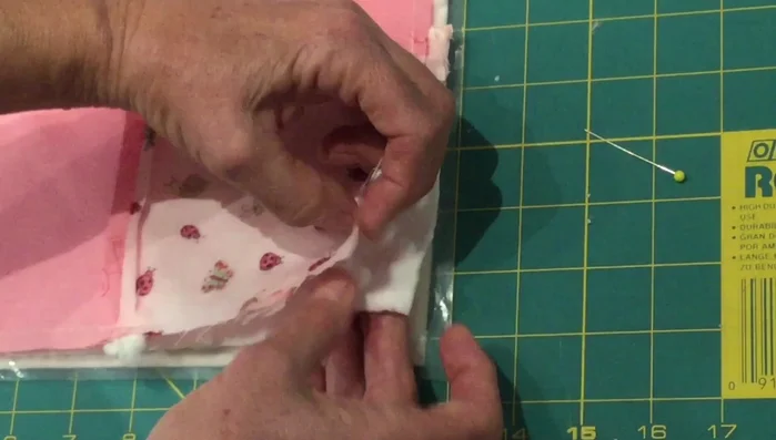 Sew around the perimeter, leaving a small opening for turning and inserting the rattles.