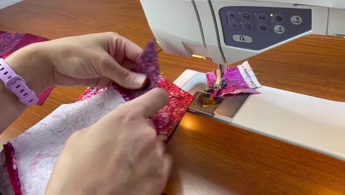 Align the rows using either the seam allowance or the blunt points, and then sew.