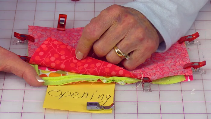 Trim the corners of the fabric, being careful not to cut into the stitching.