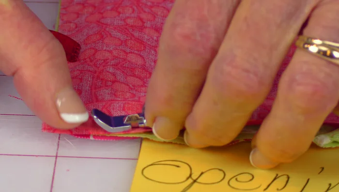 Trim the corners of the fabric, being careful not to cut into the stitching.