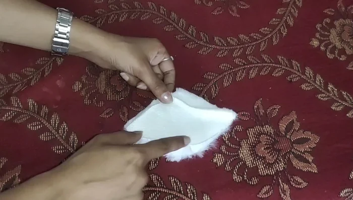 Create and attach the side pieces of the elephant's head.