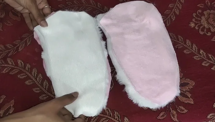 Create and attach the side pieces of the elephant's head.