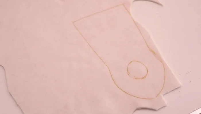 Stuffing the doll body.