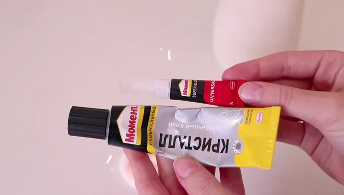 Attaching the hands to the doll body with super glue.