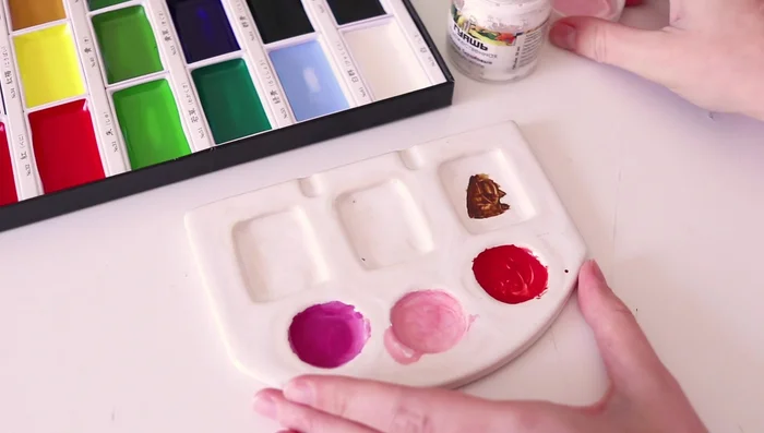 Adding accents and lightening colors with white gouache.