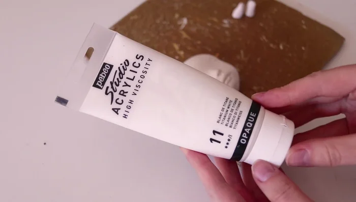 Spraying with varnish to create a smoother surface.