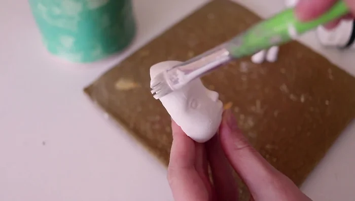 Spraying with varnish to create a smoother surface.