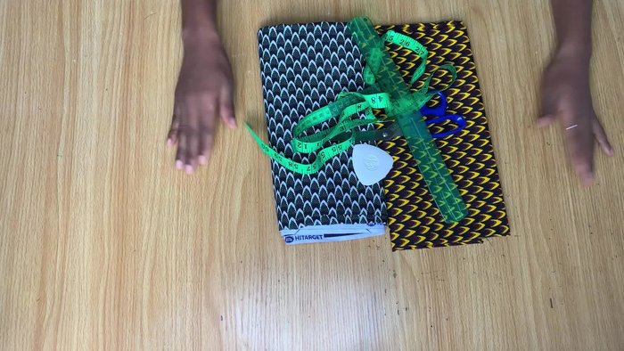 Cut the fabric pieces. The length of the shorter fabric piece (brown, top layer) is determined by your desired skirt length (11 inches in this example, 10 inches after gathering). The length of the longer piece (white and green, bottom layer) should account for gathers and the final skirt length (18 inches in this example, 20 inches after adding the waistband).