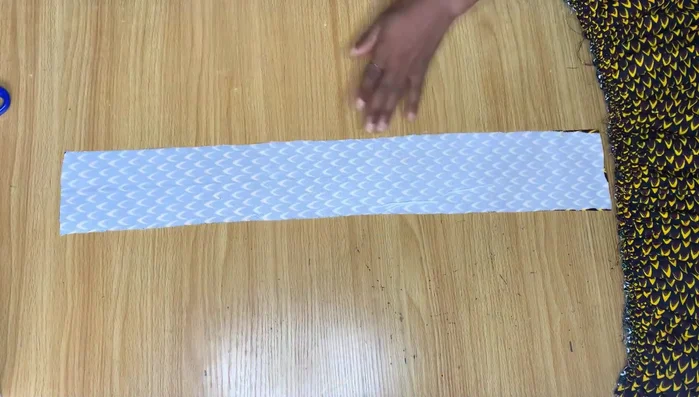 Finish the waistband. Fold the raw edge of the waistband over to the inside and stitch, creating a neat finish and hiding the stitching. Repeat for the top of the skirt.