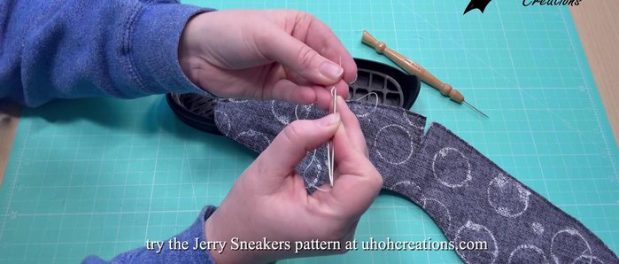 Secure the thread end by creating small loops close to the end, and then gently pulling tight to create a secure knot. Alternatively, you can use a lighter to melt and fuse the ends after tying a knot. This is for security; the stitches themselves will hold the shoe together.