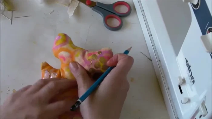 Add final details using textured gems, setting aside to dry overnight.