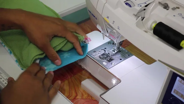 Close the opening using a ladder stitch by hand, hiding the knot inside the seam allowance. Use thread that matches the fabric color.