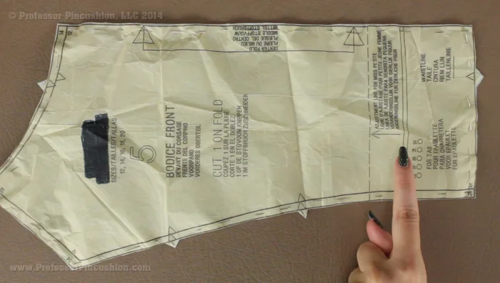 Mark your pattern pieces. Use tailor’s tacks or carefully cut notches, sealing them with fabric sealant to prevent fraying (226.76, 243.799). You can also mark directly on the tissue paper underneath (282.039).