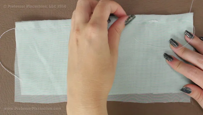 Finish your seams. Remove the tissue paper after sewing (347.479). For chiffon, a French seam is recommended for a clean, fray-resistant finish (428.879).