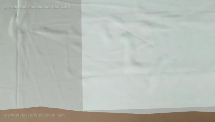 Cut out your pattern pieces. Use tissue paper under the fabric to prevent slippage (84.119). Alternatively, use liquid stabilizer or spray starch to stiffen the fabric (119.399). Ensure a single layer of fabric when cutting (142.92). For pattern pieces on the fold, pin, outline, unpin, flip, and re-pin before cutting (162.84).