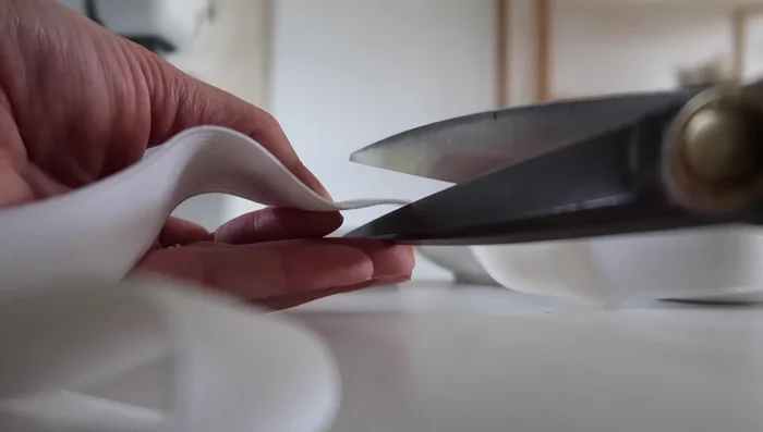 Overlap the elastic ends and sew them together to form a closed circle.