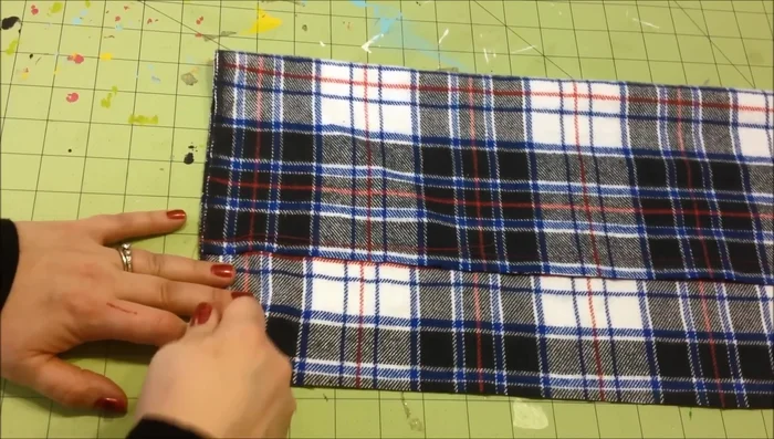 Use a seam ripper to carefully separate the horizontal threads from the vertical threads in the fringe section. Pull loose threads to create fringe.