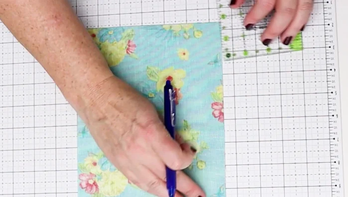 Create Box Bottom: Mark and cut out 1.5" squares from both bottom corners of each fabric piece (exterior and lining).