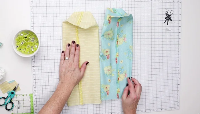 Assemble Bag: Turn the exterior right side out. Insert the exterior into the lining, matching seams. Pin or clip the top edges together and sew all the way around.