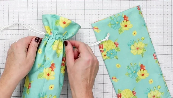 Create Drawstring Channel: Mark two lines for the drawstring channel: 2" from the top edge, and 3/4" below that line. Sew along both lines.