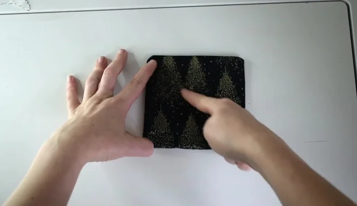 Decorative stitching: Sew a stitch all the way around the coaster, followed by diagonal stitches and a square stitch in the middle for a quilted look.