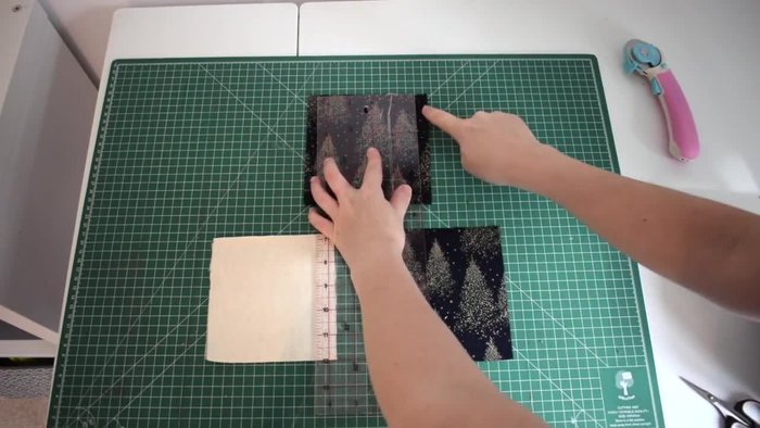 Cut out fabric pieces: Two pieces of main fabric (5.5 inches x 5.5 inches) and one piece of wadding (5 inches x 5 inches).