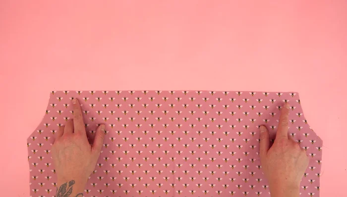 Attach front panels to back panel, press seams, and topstitch.