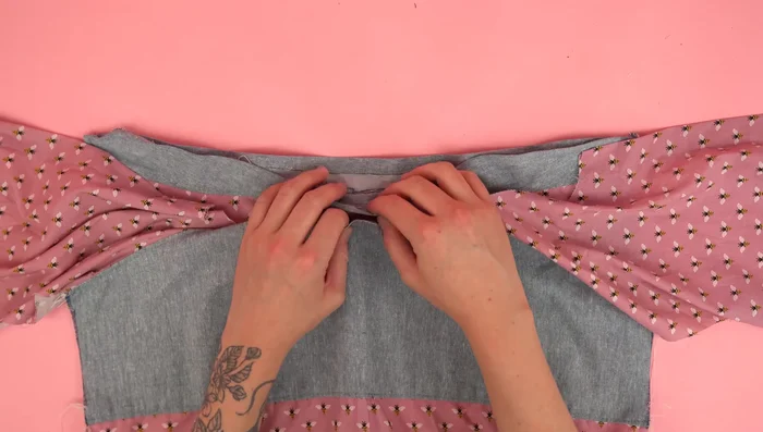 Attach collar assembly to neckline, press, and topstitch.