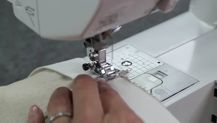 Zigzag stitch the elastic to the fabric, stretching the elastic as you sew. (1.4 length, 3.5 width)