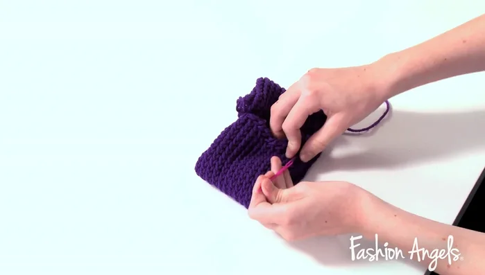 Sew the ends of the headband together using the excess purple yarn and needle.