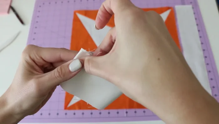 Quarter your quilt top and border fabric using finger pressing or other methods to mark the center and quarter points.