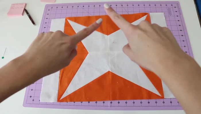 Quarter the quilt (including side borders) and top/bottom borders, pin them in place, and sew them on, paying attention to easing any extra fabric.