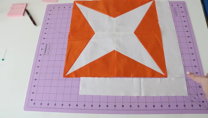 Press seams open and check for squareness. Make minor adjustments as needed, ensuring the quilt corners are perfect 90° angles.