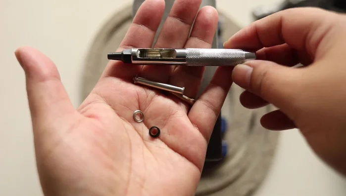 Load and finish: Load tools and roll the tool roll. Wrap and secure the leather cord.