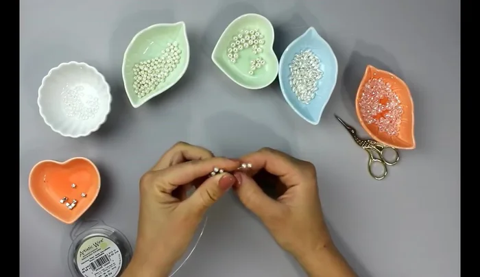 Repeat step 6 until all five rows of beads are added to the branch.