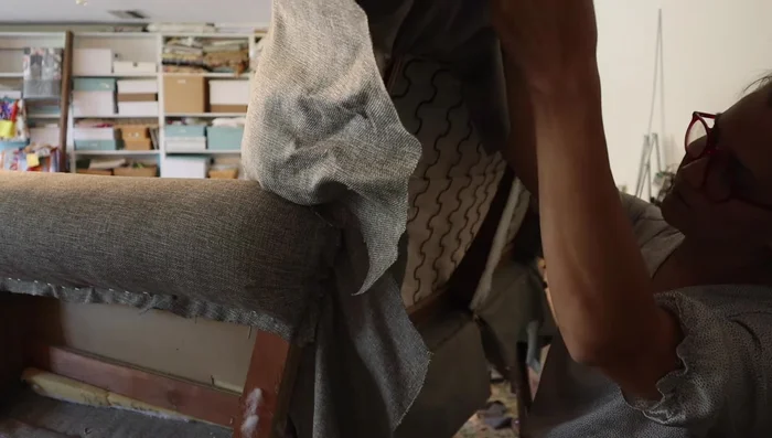 Attach the inside back piece. Make relief cuts as needed to eliminate puckering and ensure a smooth fit. Pull and staple to secure.