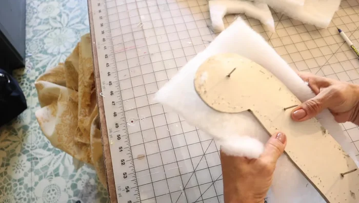 Attach the final piece. Use existing nail holes or tiny trim nails to attach the final piece, concealing them by weaving fabric grains around the nail heads.