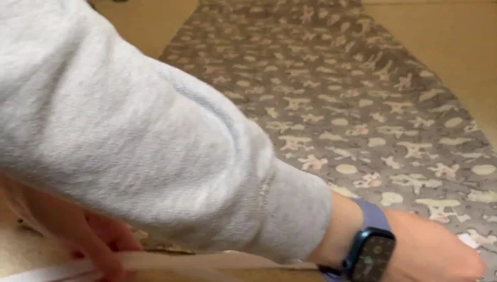 Prepare the zipper placement on the fabric.