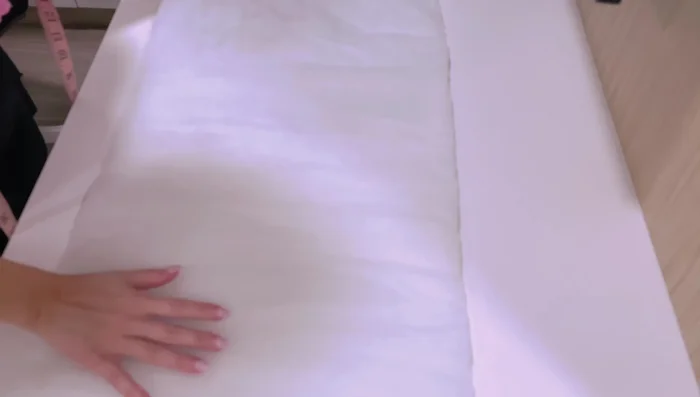 Secure layers with clips, basting, or pins.