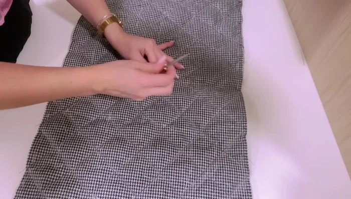 Remove basting stitches; trim excess batting.