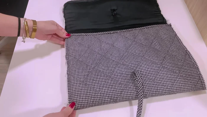 Fold and secure bias tape, hand-sew for cleaner finish if necessary.