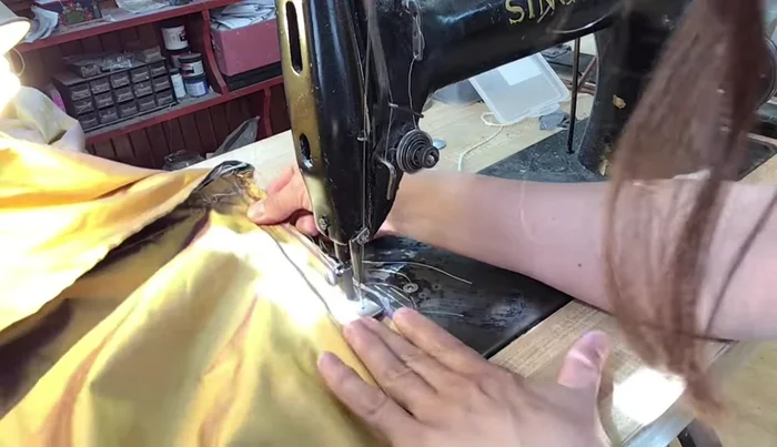 Stitch the outside back panel over the ties, ensuring a snug fit.