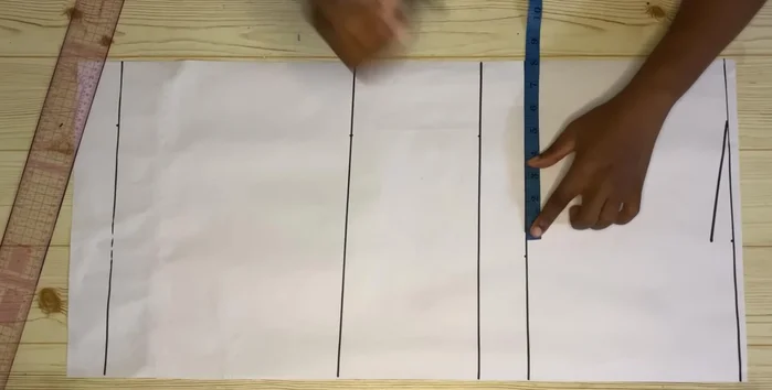 Mark your round bust measurement divided by four on the chest line. Use a curve to shape the armhole.