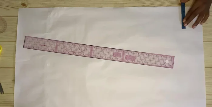 Extend the lines and add 0.75 inch (or desired lapel width) to the neckline for the lapel.