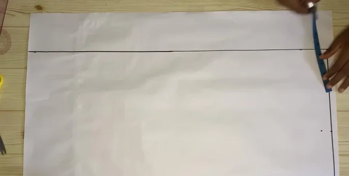 Extend the lines and add 0.75 inch (or desired lapel width) to the neckline for the lapel.