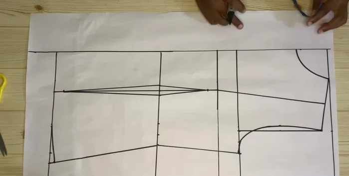 Extend the lines and add 0.75 inch (or desired lapel width) to the neckline for the lapel.