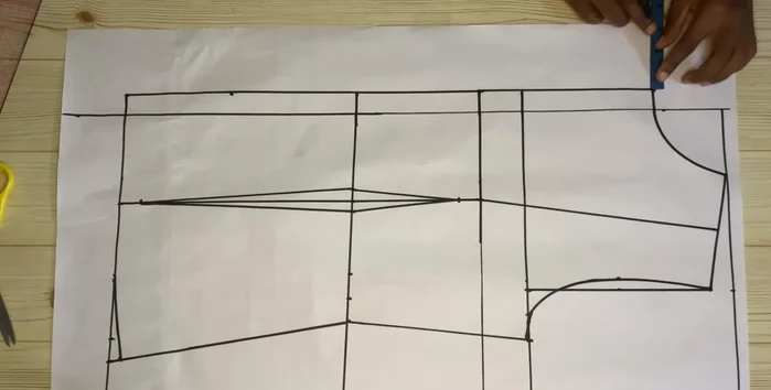 Extend the lines and add 0.75 inch (or desired lapel width) to the neckline for the lapel.
