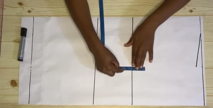 Mark your round bust measurement divided by four on the chest line. Use a curve to shape the armhole.