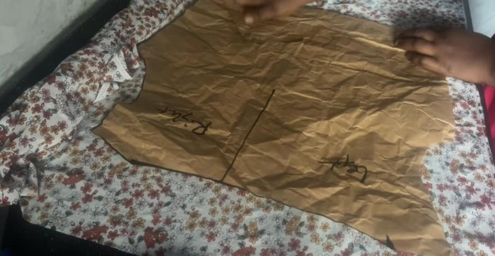 Create the front pattern's rouched section by marking 2-2.5 inches from the armhole and connecting the lines to create a slash-and-spread effect.