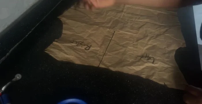 Create the front pattern's rouched section by marking 2-2.5 inches from the armhole and connecting the lines to create a slash-and-spread effect.